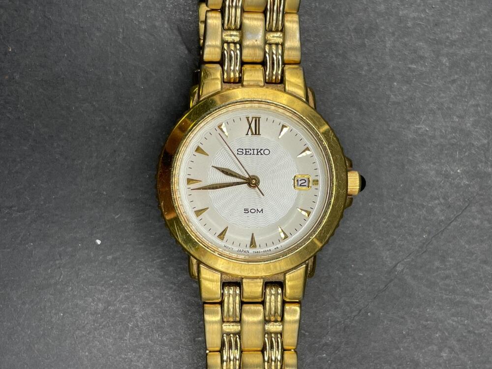 Seiko Women's Quartz 7N82-0BR0 Date 50M Watch Gold Tone Bracelet Band White Dial